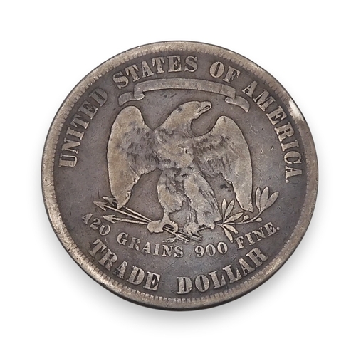 5026 - United States (1776-date) Trade Dollar 1877ObverseLeft-facing seated Liberty, who extends her right ... 