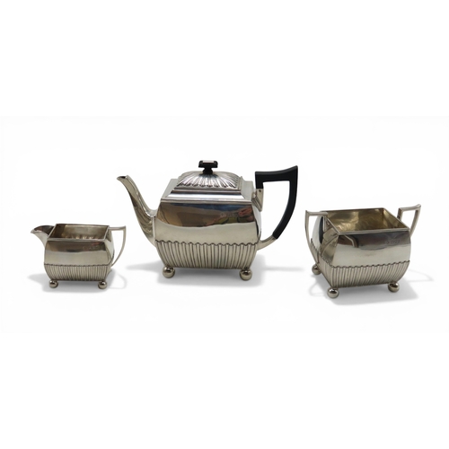 A three piece silver tea service, by Horace Woodward & Co, London 1894, of rectangular form, the bodies part-fluted, 1,010gms