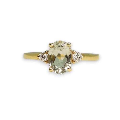 762 - An 18ct gold green amethyst and diamond ring, size M1/2, weight 2.4gms
