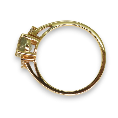 762 - An 18ct gold green amethyst and diamond ring, size M1/2, weight 2.4gms