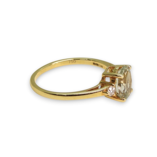 762 - An 18ct gold green amethyst and diamond ring, size M1/2, weight 2.4gms