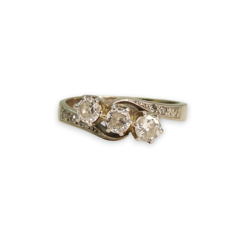 763 - An 18ct white gold three stone diamond ring, set with estimated approx 0.50cts in total including th... 