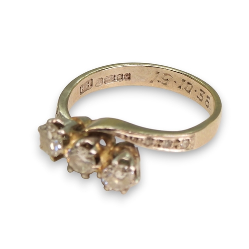 763 - An 18ct white gold three stone diamond ring, set with estimated approx 0.50cts in total including th... 