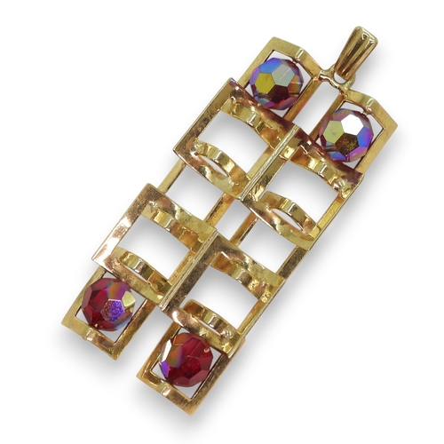 767 - A 9ct gold retro pendant, London hallmarks for 1972, set with four glass beads, Length with bail 4.9... 
