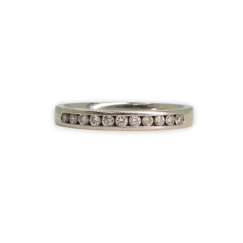 773 - A platinum diamond set half eternity ring, size L1/2, weight 2.9gms.