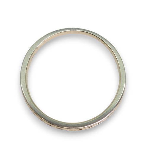 773 - A platinum diamond set half eternity ring, size L1/2, weight 2.9gms.