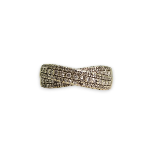 774 - A 9ct white gold pave diamond set cross over ring, set with estimated approx 0.50cts of brilliant cu... 