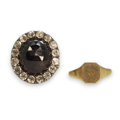 777 - A Georgian style ring, set with a large multi facet cut oval garnet of approx 15mm x 13mm, surrounde... 