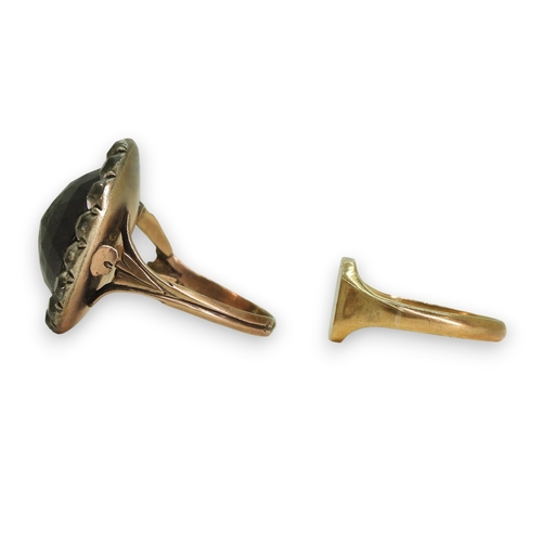 777 - A Georgian style ring, set with a large multi facet cut oval garnet of approx 15mm x 13mm, surrounde... 