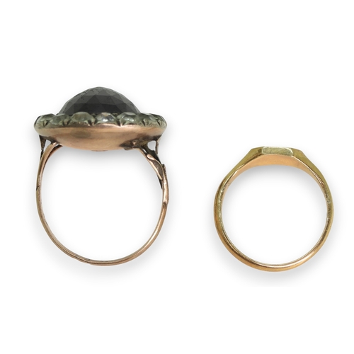 777 - A Georgian style ring, set with a large multi facet cut oval garnet of approx 15mm x 13mm, surrounde... 