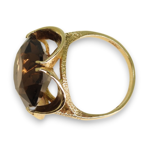 779 - A 9ct gold large smoky quartz ring, diameter 15.5mm, size N1/2, weight 6gms