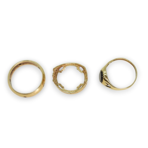 782 - A 9ct gold wedding ring set with clear gems (two missing) size R, a 9ct onyx signet ring size O1/2 a... 