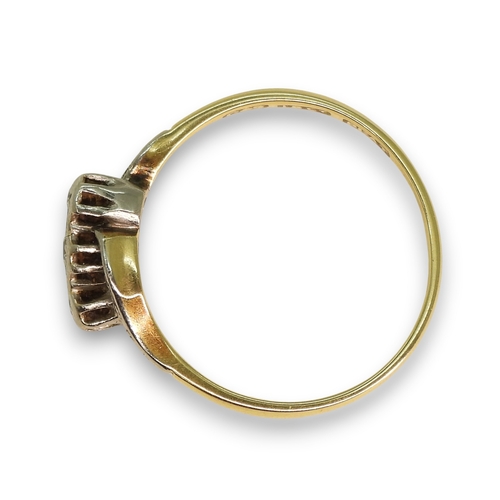 787 - An 18ct gold vintage illusion set three stone diamond ring on a twist, size M1/2, 2.1gms