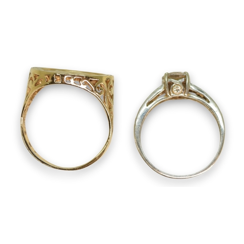 789 - A 9ct white gold cz set solitaire ring, size N, together with a faux coin 9ct gold ring, size R, wei... 