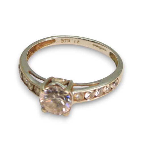 789 - A 9ct white gold cz set solitaire ring, size N, together with a faux coin 9ct gold ring, size R, wei... 