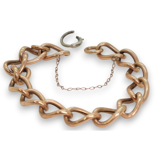 795 - A 9ct rose gold curb chain, with a white metal (probably silver) clasp, weight without the clasp 9.5... 