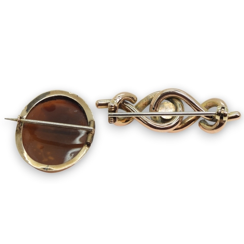 797 - A well carved shell cameo in a yellow metal mount, a similar cameo ring, size L, and a yellow metal ... 