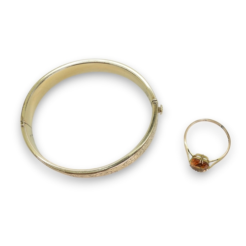 801 - A 9ct gold citrine ring, size V1/2 weight 1.7gms,&nbsp;together with a&nbsp;gold plated bangle.