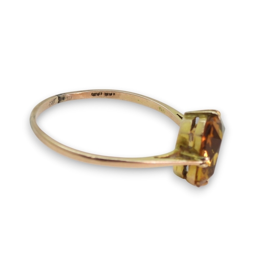 801 - A 9ct gold citrine ring, size V1/2 weight 1.7gms,&nbsp;together with a&nbsp;gold plated bangle.