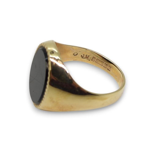 807 - A 9ct gold onyx signet ring, size U1/2, weight 7.5gms