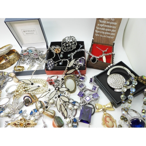 864 - A Vivienne Westwood pendant and chain, a gold plated engraved bangle, a Scottish style pendant by Ja... 