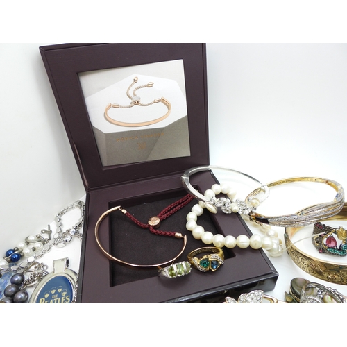 864 - A Vivienne Westwood pendant and chain, a gold plated engraved bangle, a Scottish style pendant by Ja... 