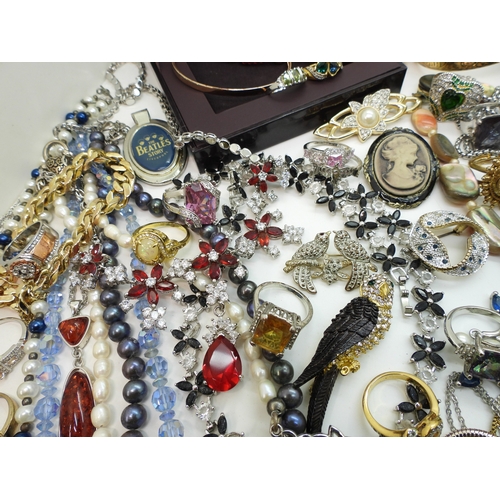 864 - A Vivienne Westwood pendant and chain, a gold plated engraved bangle, a Scottish style pendant by Ja... 