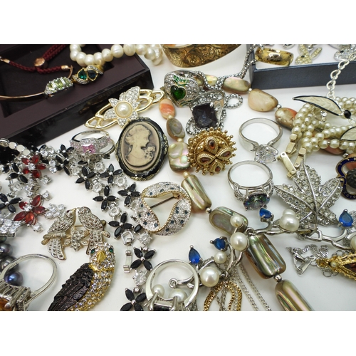 864 - A Vivienne Westwood pendant and chain, a gold plated engraved bangle, a Scottish style pendant by Ja... 