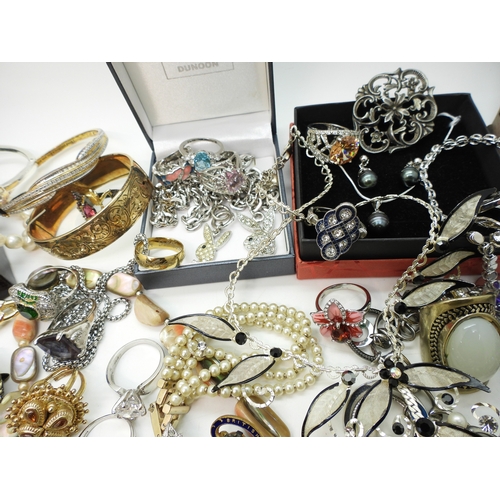 864 - A Vivienne Westwood pendant and chain, a gold plated engraved bangle, a Scottish style pendant by Ja... 