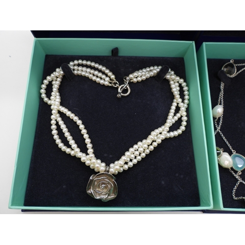 865 - Two Dower & Hall necklaces, to include a three strand cultured pearl necklace with a rose pendan... 