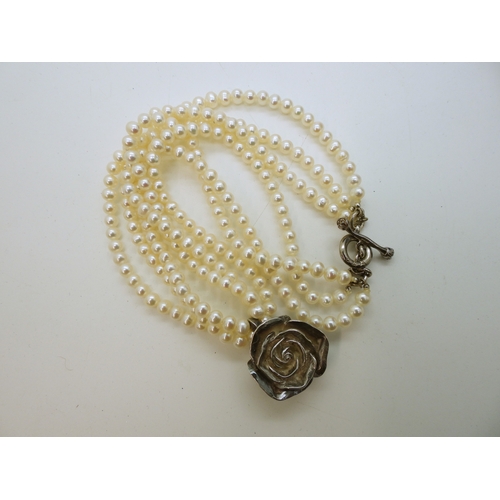 865 - Two Dower & Hall necklaces, to include a three strand cultured pearl necklace with a rose pendan... 