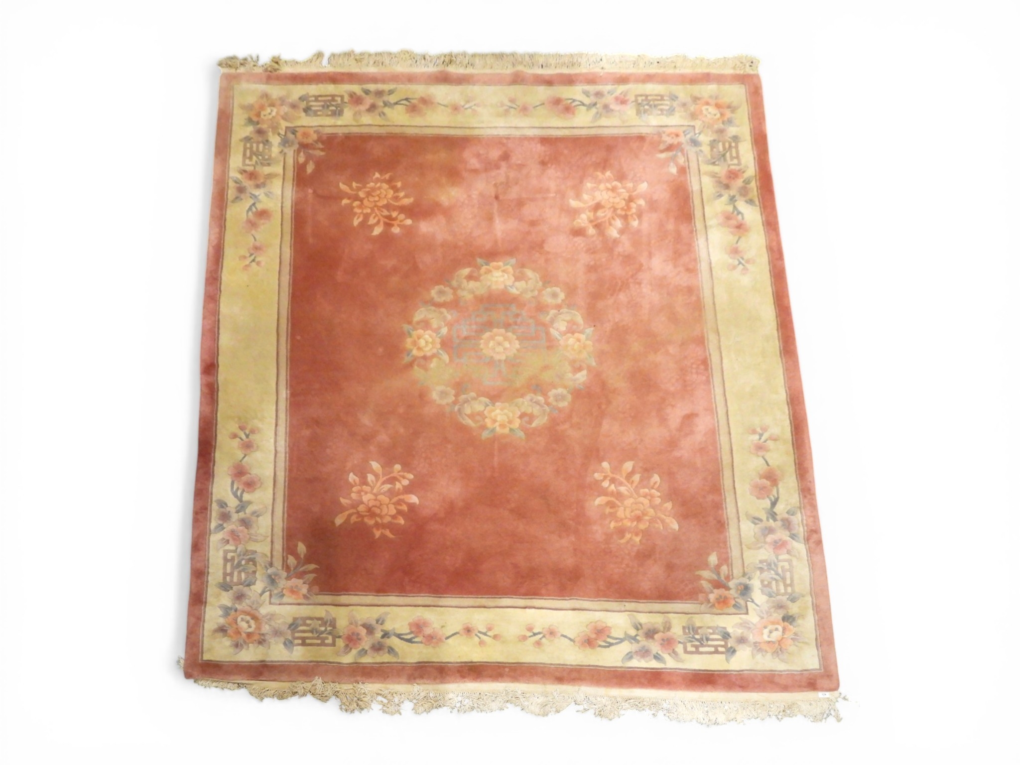 A large pink deep pile Oriental style rug with cream floral patterned ...