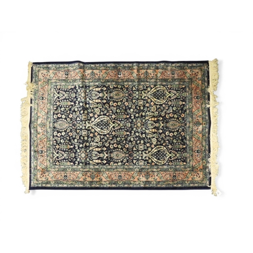A contemporary dark blue eastern style rug with all over floral ...