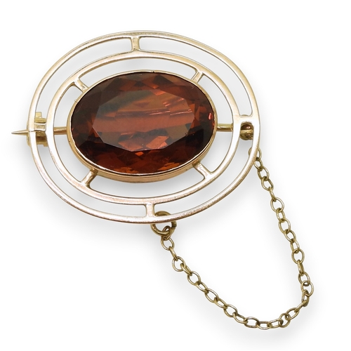 724 - A 9ct gold brooch set with a 17.5mm x 12.5mm cognac coloured citrine quartz, weight 6gms