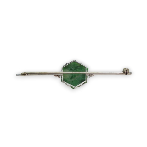 725 - A 9ct white gold bar brooch set with a Chinese green hardstone panel carved with fruit & foliage... 