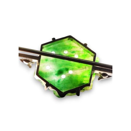 725 - A 9ct white gold bar brooch set with a Chinese green hardstone panel carved with fruit & foliage... 