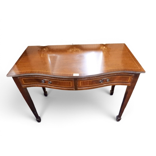 21 - A 20th century mahogany reproduction serpentine front two drawer hall table on square tapering suppo... 