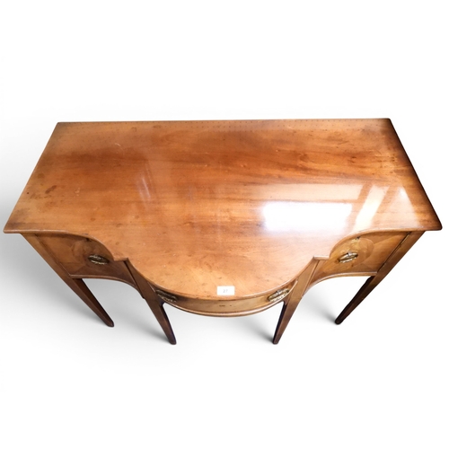 27 - An early to mid 20th century mahogany Georgian style serpentine front sideboard with bow front centr... 