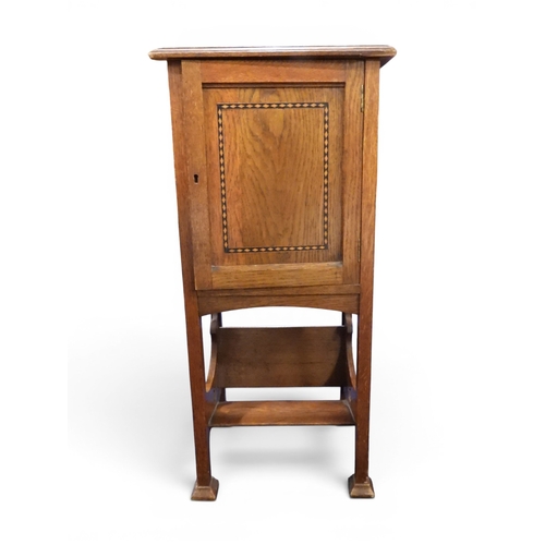 32 - A late 19th century oak free standing pipe/smokers cabinet with pipe rack mounted to inside of door ... 