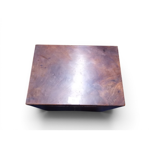 33 - A small 19th century mahogany veneered cellarette with hinged top over brass carry handles on square... 