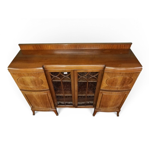5 - A 20th century mahogany display cabinet with pair of beaded glazed doors flanked by bow fronted cabi... 