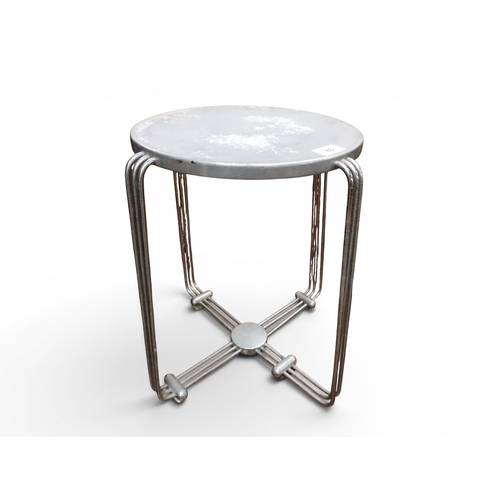A circa 1930 Art Deco Alpax chromed steel and aluminium stool with circular seat on tubular shaped supports, 40cm high x 39cm diameter