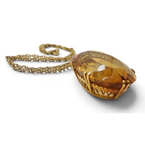 700 - A very large citrine gemstone in a handmade bright yellow metal setting, dimensions of the citrine 4... 