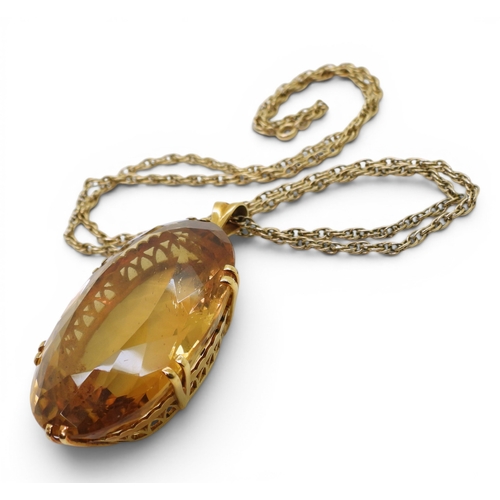 700 - A very large citrine gemstone in a handmade bright yellow metal setting, dimensions of the citrine 4... 