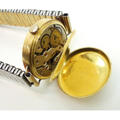 702 - An 18ct gold cased Swiss watch, hallmarked london 1922 to case and dust cover&nbsp; diameter 3.2cm, ... 