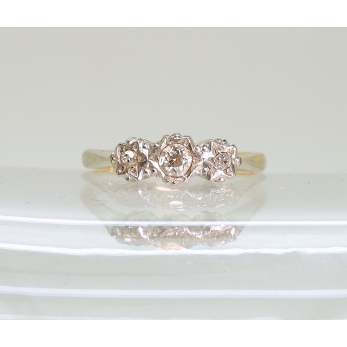 707 - A 9ct gold three stone illusion set diamond ring, size M1/2, weight 2.3gms