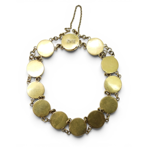710 - A Chinese gold symbol bracelet stamped '18' with the makers mark TC, length 19.5cm, weight 11.6gms