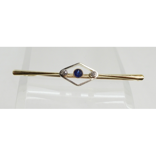 718 - A 15ct gold bar brooch set with a sapphire and diamonds, length 5.5cm, weight 4.6gms