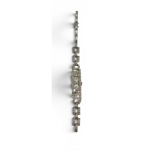 720 - A platinum and diamond cocktail watch, set with baguette and eight cut diamonds in an Art Deco desig... 