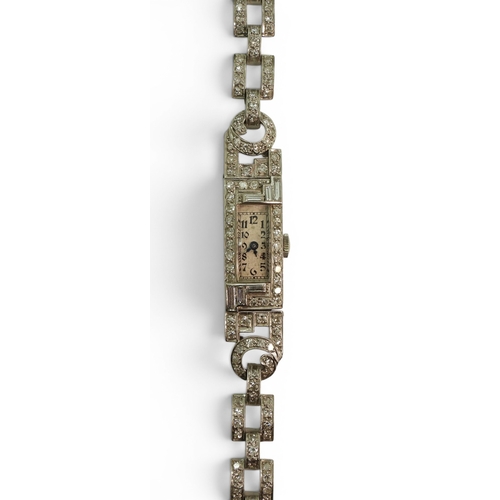 720 - A platinum and diamond cocktail watch, set with baguette and eight cut diamonds in an Art Deco desig... 